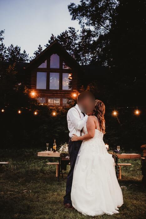 Dusk, string lights, and the lodge, wedding at Edgetts Lodge, Luther Michigan