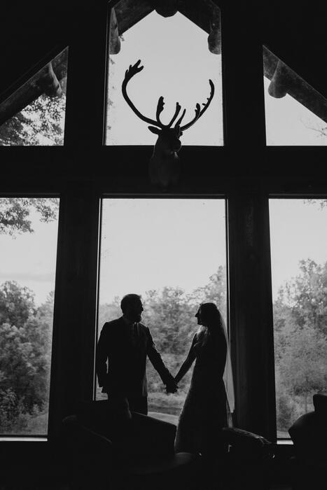 First look at the antler window, wedding at Edgetts Lodge, Luther Michigan