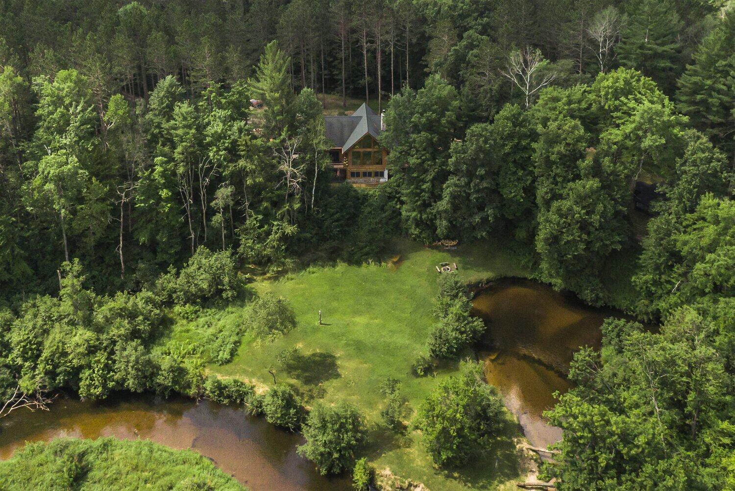 Edgetts Lodge, Luther Michigan, 38 wooded acres on a bend of the Pine